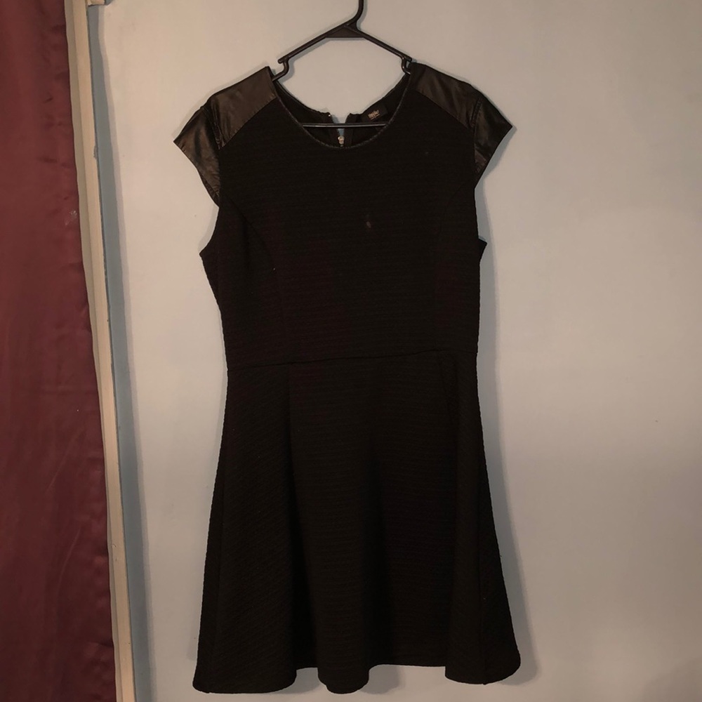 Black dress with leather at the top of the arms